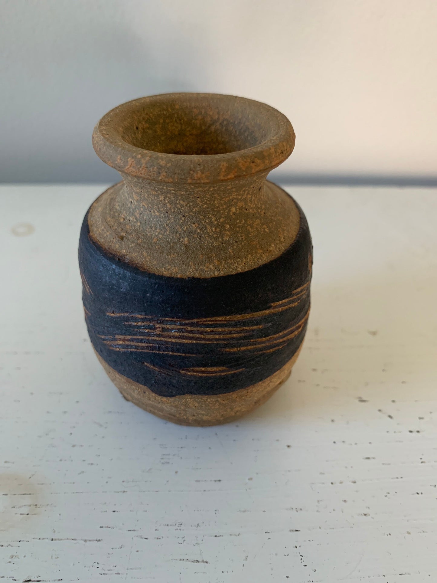 Small handthrown clay bud vase