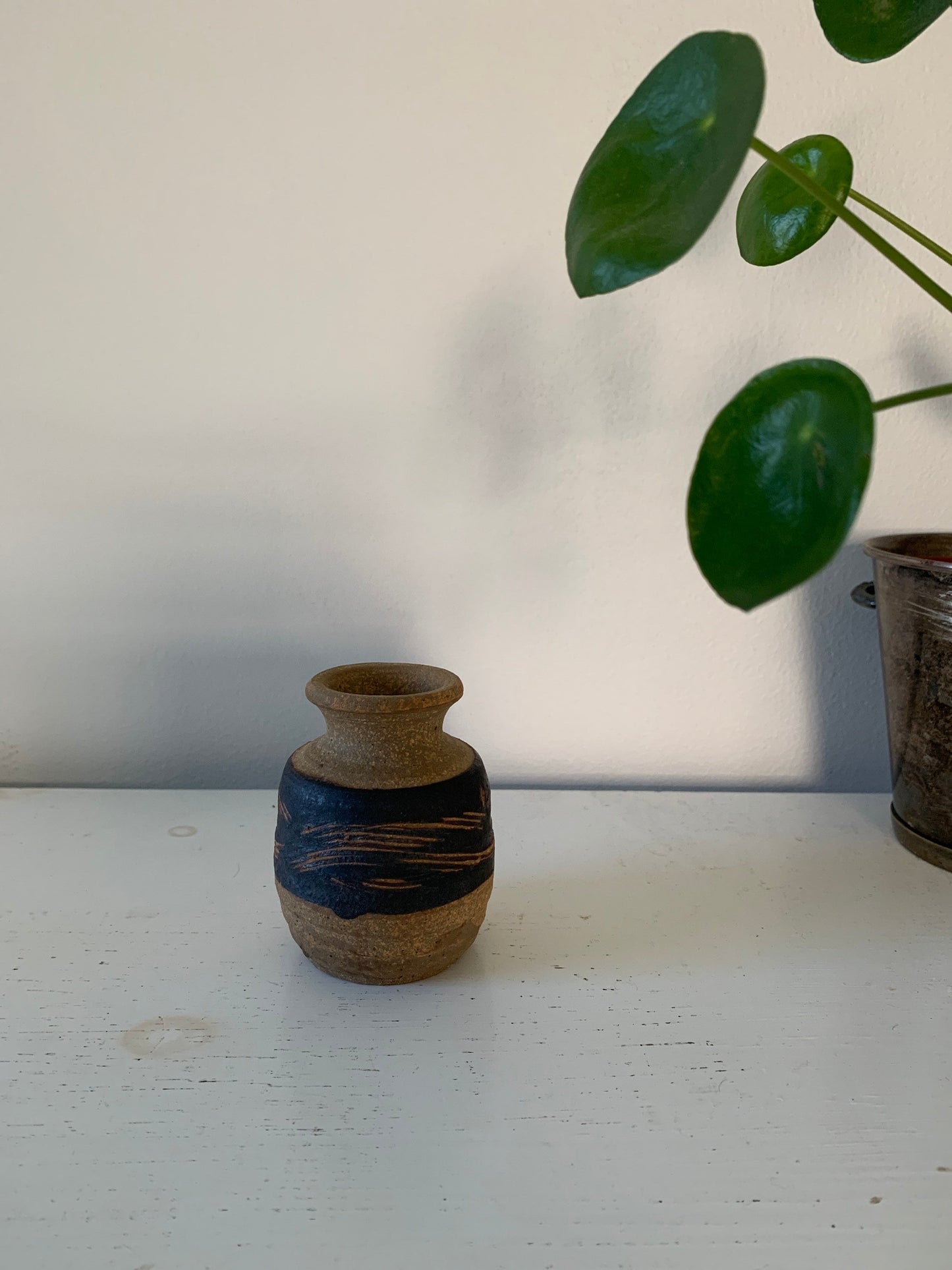 Small handthrown clay bud vase
