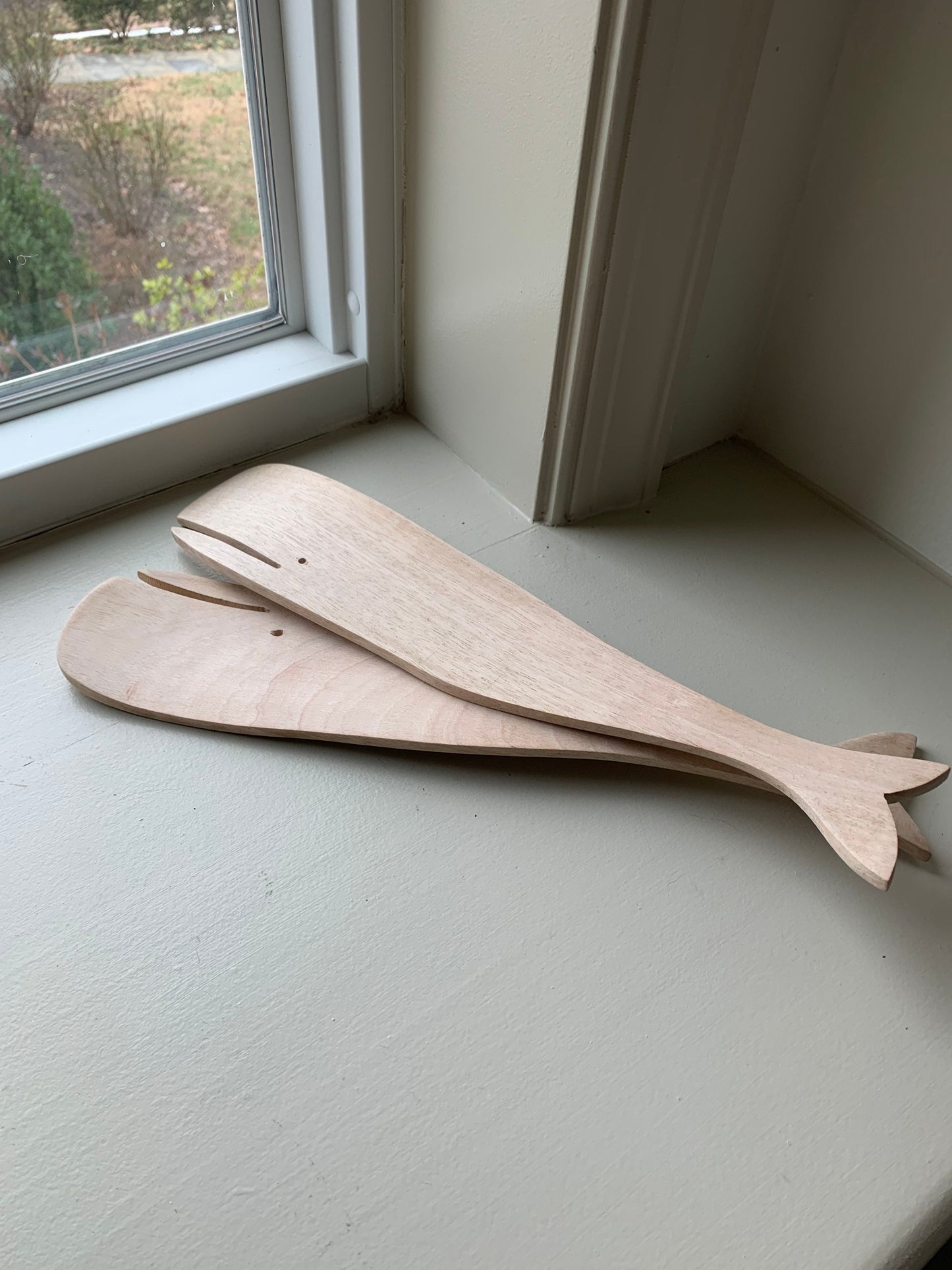 12.5” long wood salad servers in sperm whale shape.