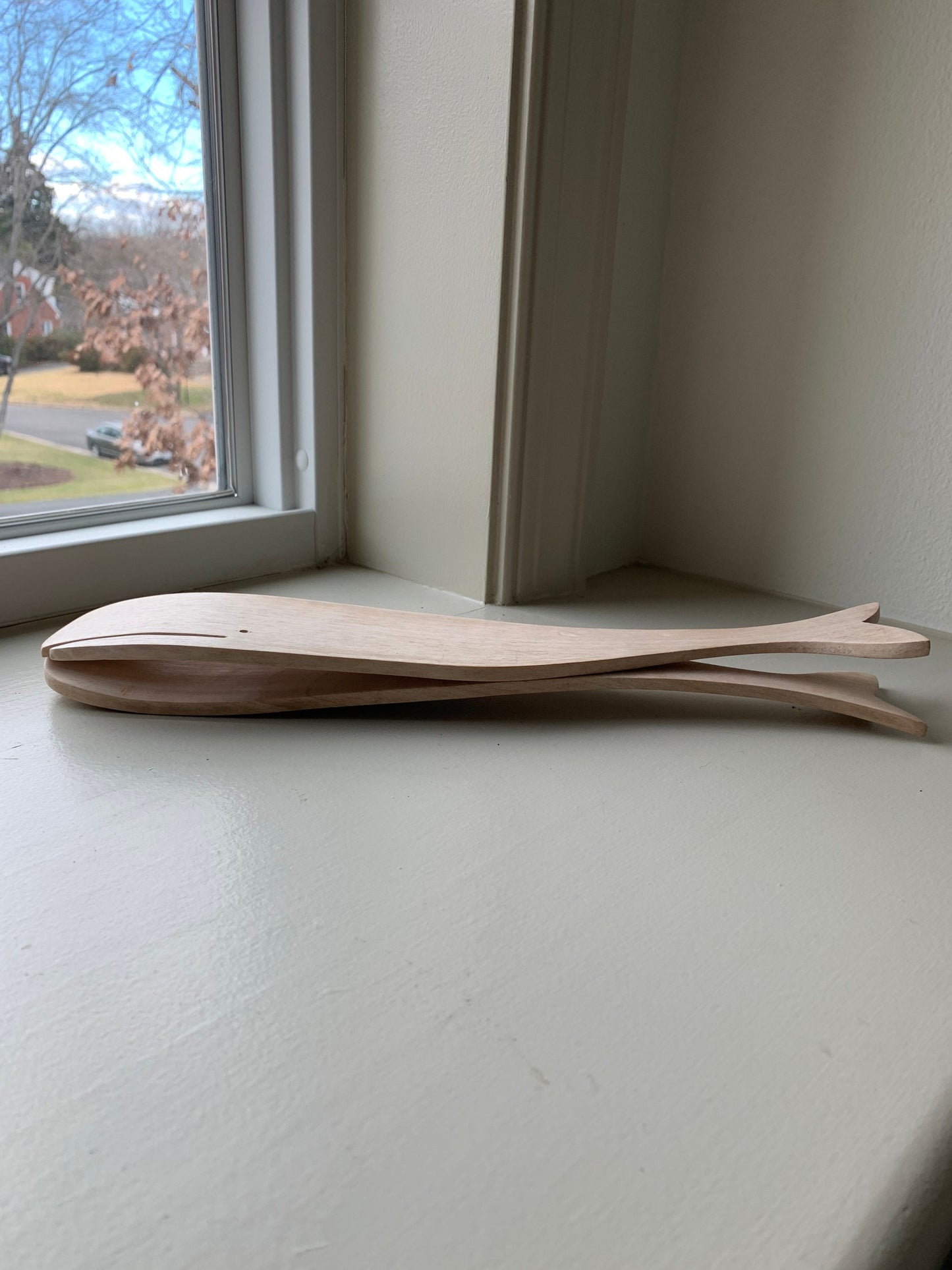 12.5” long wood salad servers in sperm whale shape.