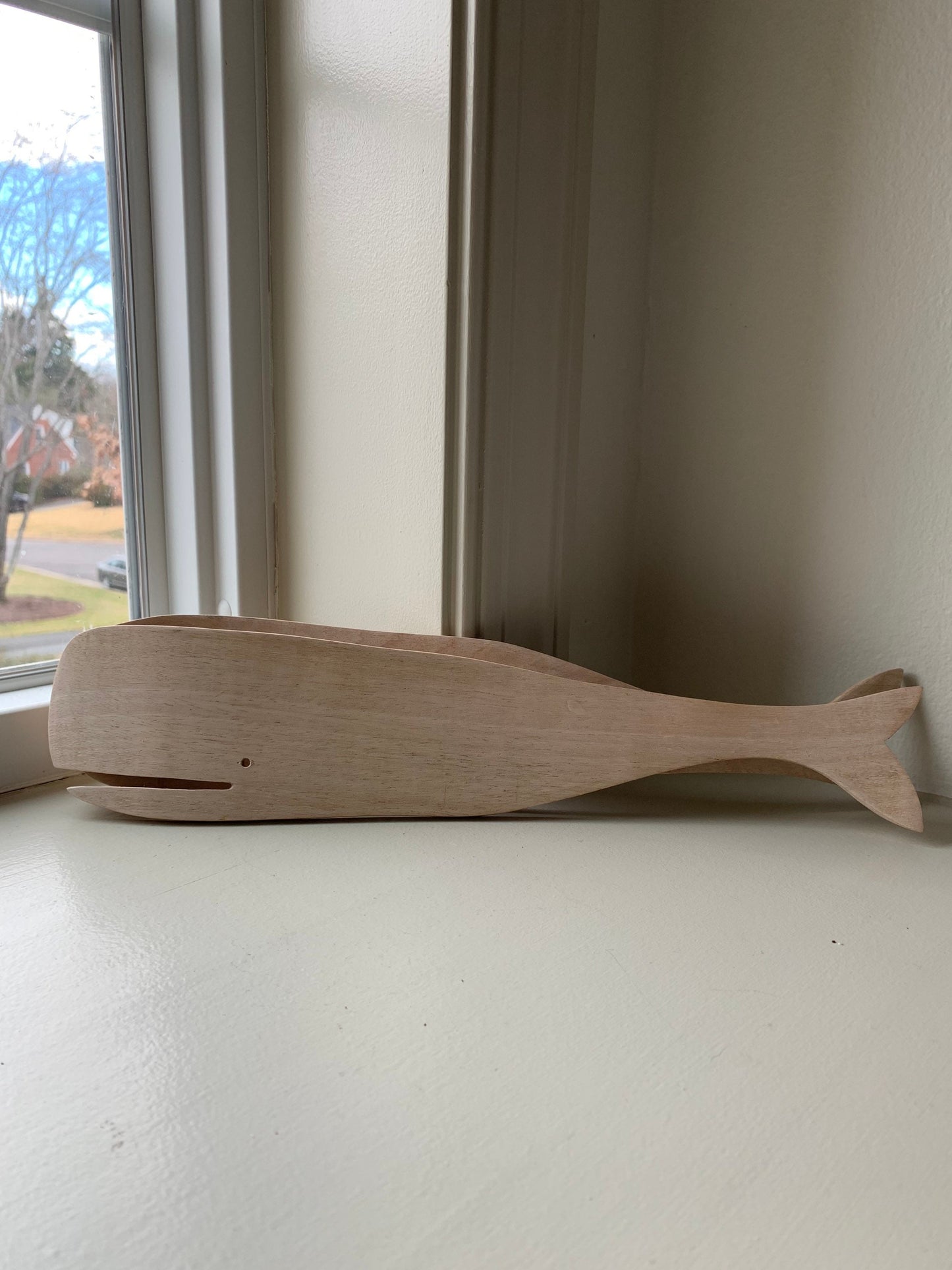 12.5” long wood salad servers in sperm whale shape.